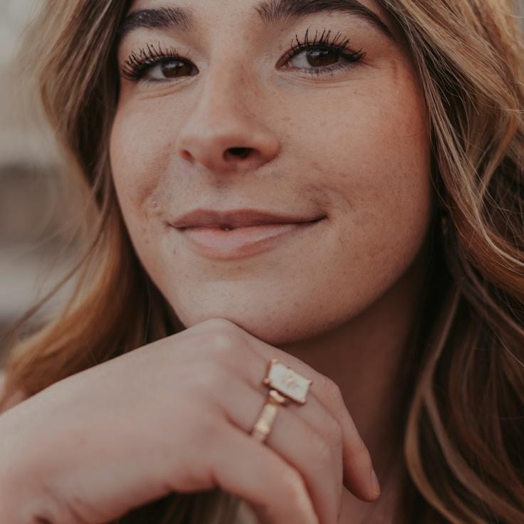 Aanya Singh, Lead Design Curator at MurmurEvenRidge, reviewing corporate floral arrangements